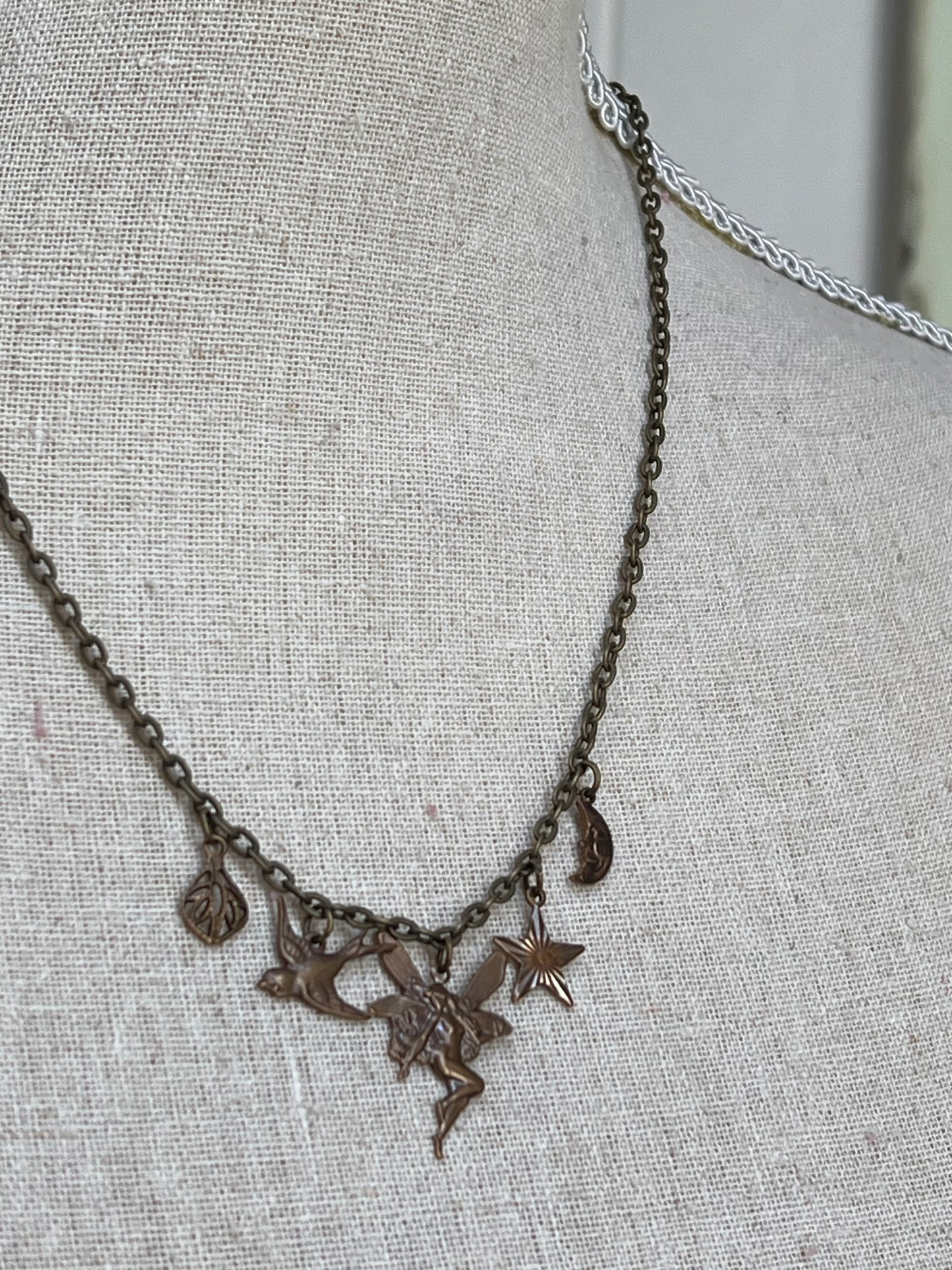 Dainty brass charm necklace